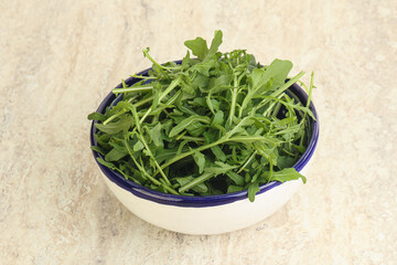 Fresh green arugula in the bowl