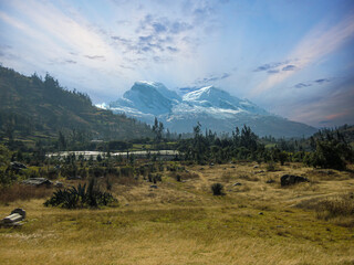 Landscape in Huaraz - Peru, with a snowy peak called Huascarán and a beautiful sky in the background.