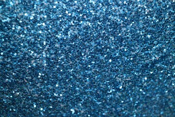 Sparkling vivid turquoise blue glitter macro close up for background texture