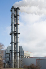 renewable energy or fossil fuels, smoke rises from the chimney of an coal-fired power station