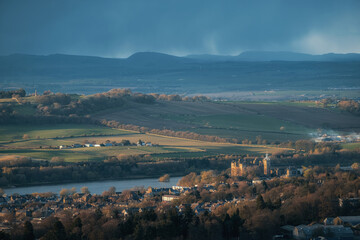 Top view of a Scottish town with an old castle on the lake at sunset. Linlithgow, Scotland