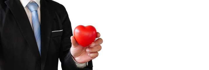 banner Businessman holding a red heart on his chest in a suit - crm, service business concept with hearts.
on a separate background 