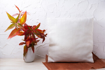 Pillow mockup with red grass in the vase