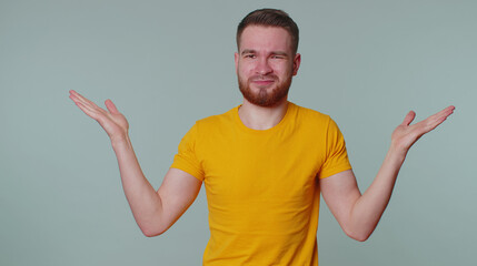 What why. Sincere tourist adult man raising hands in indignant expression asking reason of failure...