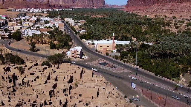 Aerial view of traffic on road 375, in sunny Saudi Arabia - circling, drone shot