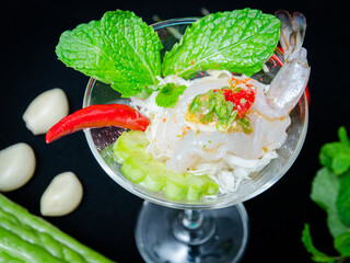 single shrimp spicy salad in glass