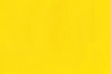 黄色の絵具を塗った無地テクスチャ背景