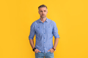mature man with gray beard. hair and beard care. male fashion model on yellow background