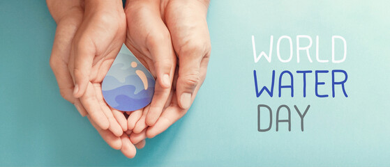 Hands holding water drop, world water day