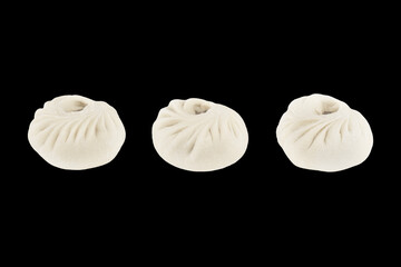 national Mongolian Chinese food dumpling Buuz filled with minced beef, isolation on a black background