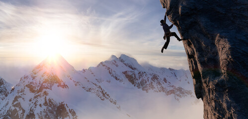 Adult adventurous man Rock Climbing a steep rocky cliff. Extreme adventure composite. 3d rendering mountain artwork. Aerial background landscape from British Columbia, Canada. Sunset Sky