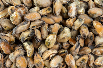 Mussels without shell at a market, frozen. Nice background shot from above.