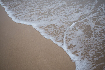 Water washing over sand on Australian South Coast beach.