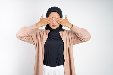 asian muslim woman closing eyes with both palms concept