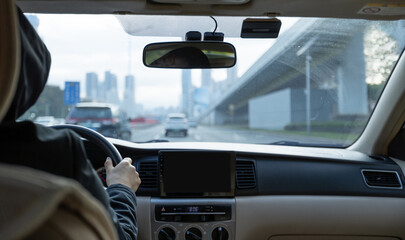 People driving car on city road