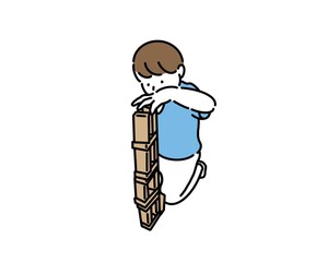 積み木を上手に積み上げる子供