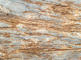 selective focus on rocks close up Beautiful pattern, looks strong. gray stone background with brown pattern caused by soil rock in nature