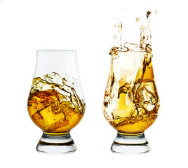 Two glasses of whiskey with ice isolated on white