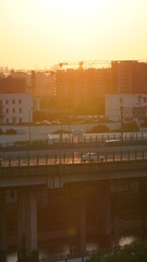 The city view with the buildings and highway in the sunset time