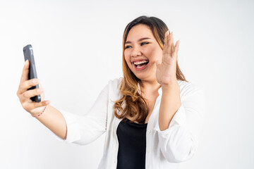 Asian woman holding a smart phone for selfie or video call