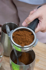 Coffee grinder in use