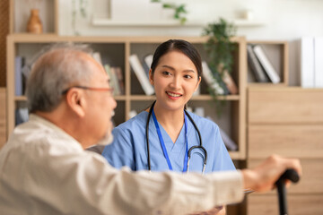 Asian doctor woman visited senior or elderly patient to diagnosis and check up health at home.Happy...