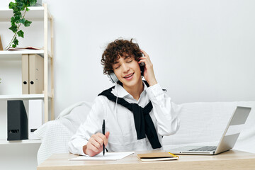 Fototapeta premium guy in headphones with a book at home Lifestyle technology