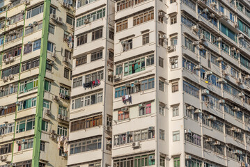 Exterior of crowded high rise residential building in Hong Kong city