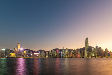 Fototapeta na wymiar Victoria harbor of Hong Kong city at dusk