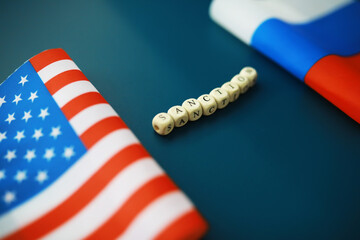 Background political. In the background are the American and Russian flags. US sanctions against...