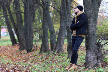 Young beard man in an autumn