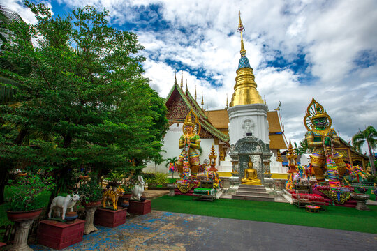 Background of religious attractions in Thailand's Chiang Mai Province, Wat Phra Pan (Wat Phranon Mee Pukha) features a large, beautiful Buddha image.