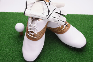Golf set, stylish white leather boots with brown golf inserts, ball and gloves