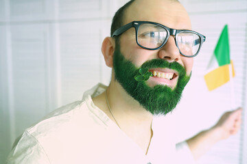 Happy saint patricks day. A man with a green beard. St.Patrick 's Day. Irish fan color beard.