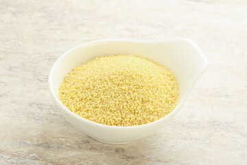 Raw couscous in the bowl