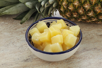 Marinated pineapple slices in the bowl