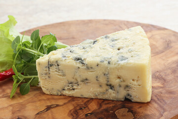 Blue cheese piece over board