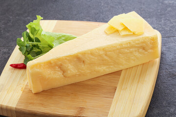 Parmesan cheese piece over board