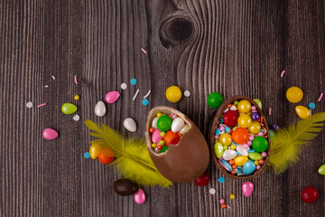 Fototapeta na wymiar Chocolate Easter eggs over rustic wooden background. Copy space