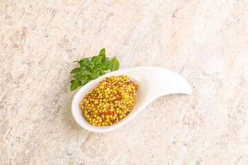 Grain mustard sauce in the bowl