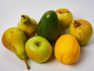 fruits pear apple lemon avocado on white background