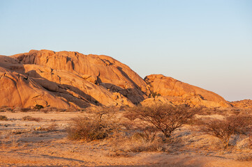 Impression of the Rocky Namibian Desert near Spitzkoppe during the golden hour around sunset.