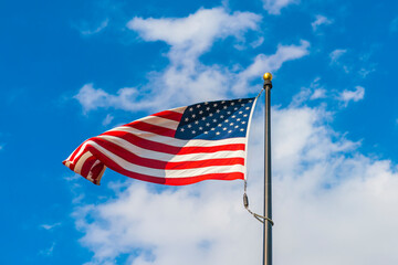 amrica flag on blue sky background.