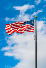 amrica flag on blue sky background.