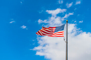 amrica flag on blue sky background.