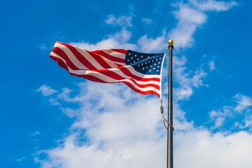 amrica flag on blue sky background.
