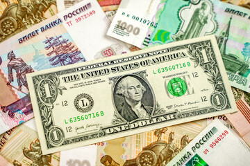 Russian and American paper money. Rubles and US dollars exchange rate.