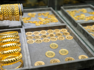 Turkish quarter gold coin with red ribbon