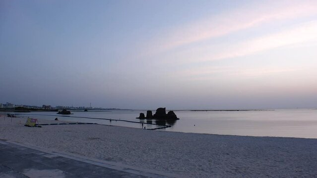 CHTAN-CHO, OKINAWA, JAPAN - AUGUST 2021 : View of Araha beach (Ocean or sea) in dusk. Sunset sky and sea. Romantic summer holiday, vacation and resort concept video.