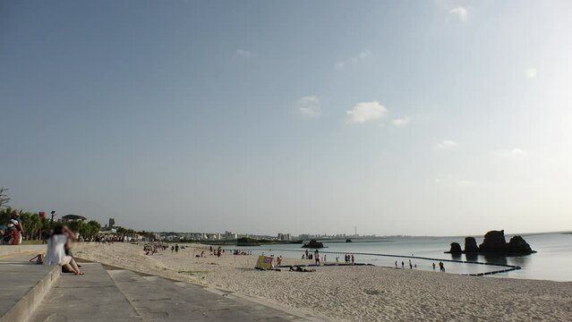 CHTAN-CHO, OKINAWA, JAPAN - AUGUST 2021 : View of Araha beach (Ocean or sea) in daytime. Summer holiday, vacation and resort concept video.